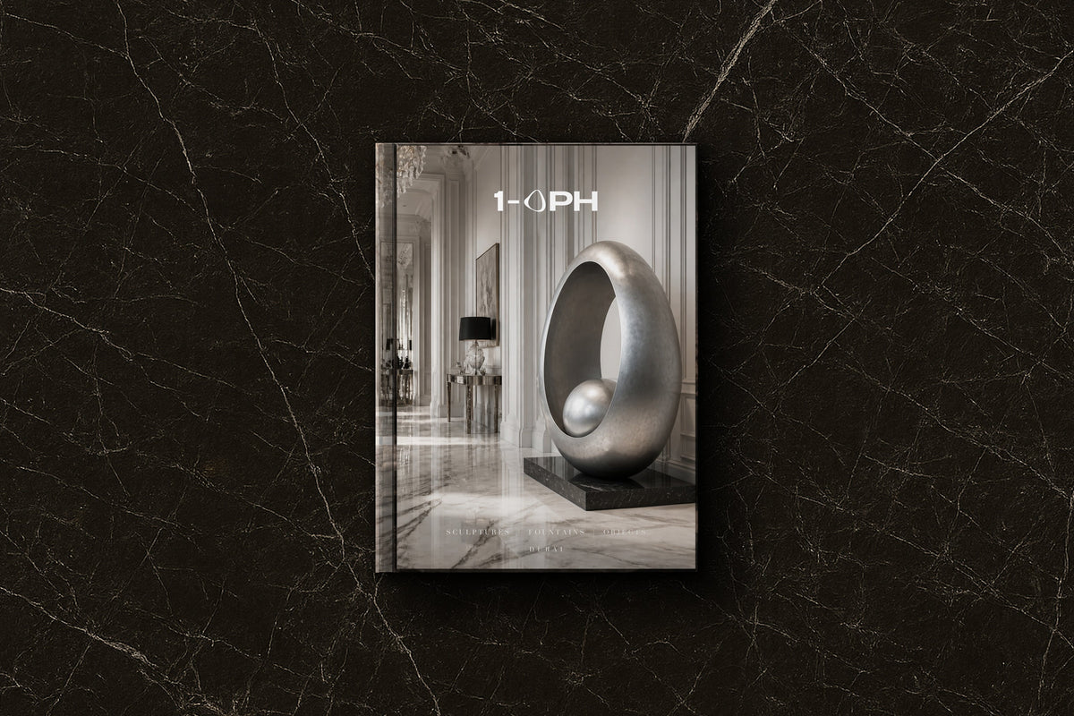 A landmark sculpture anchoring a grand hotel lobby at the arrival moment, scaled to command the volume