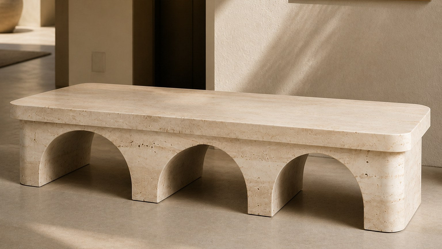 Limestone bench Reposo 180, warm cream, on a pale stone floor.
