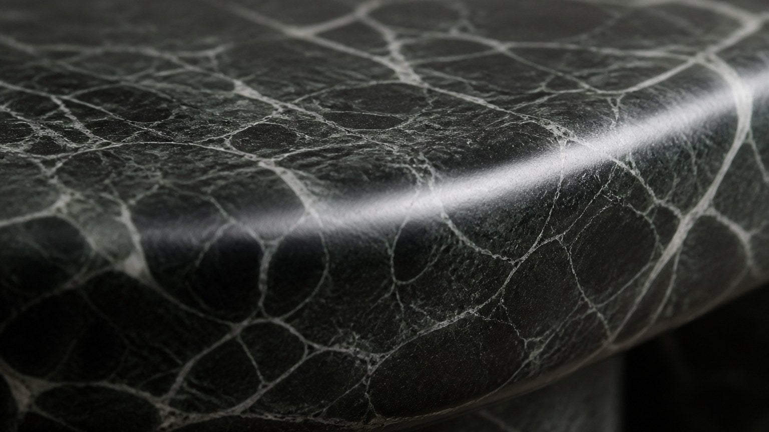 Green marble bench Serena 180, deep green with white veining, on a pale stone floor.