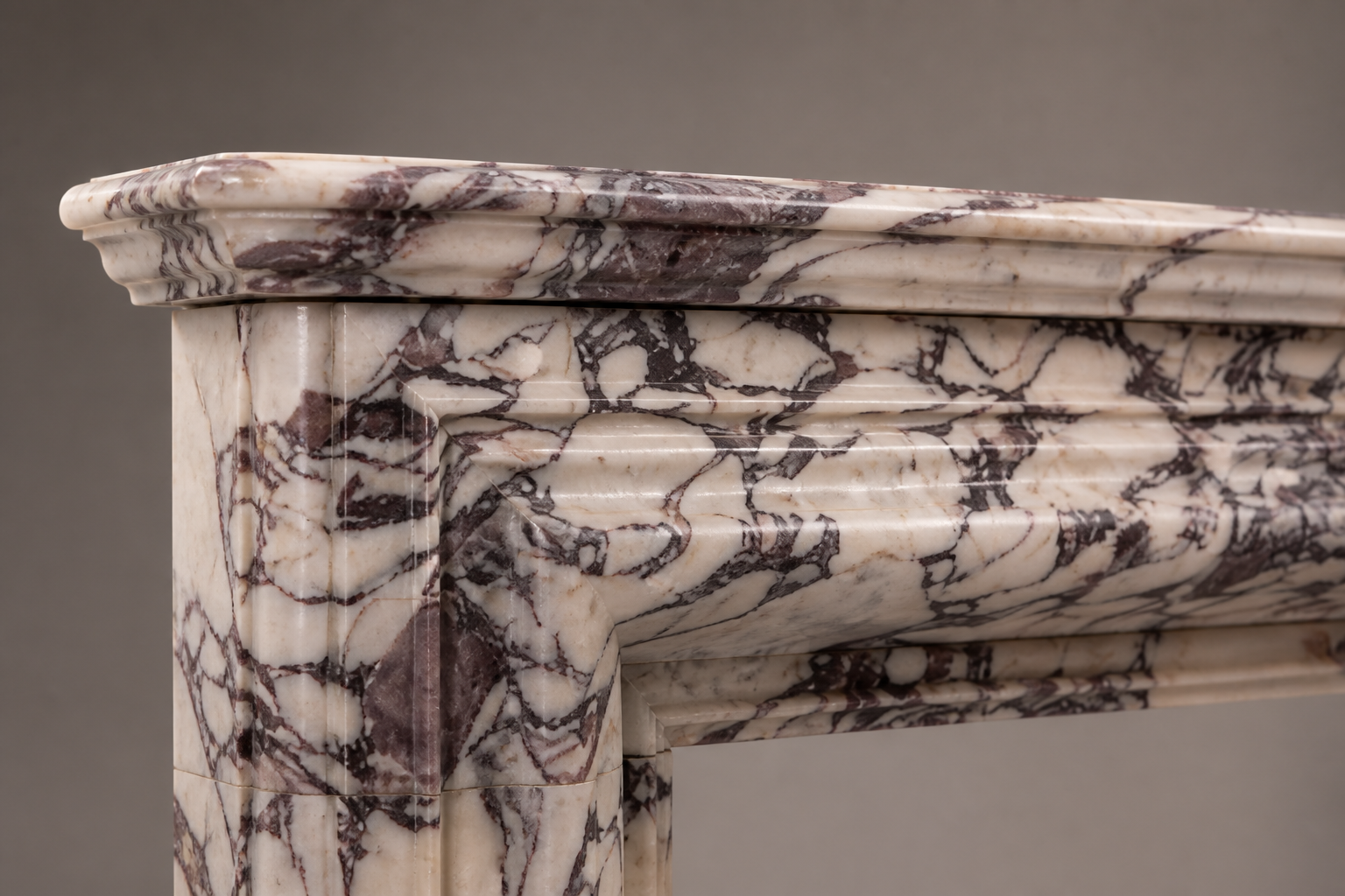 Malva breccia viola marble fireplace mantel by 1-OPH, surface detail