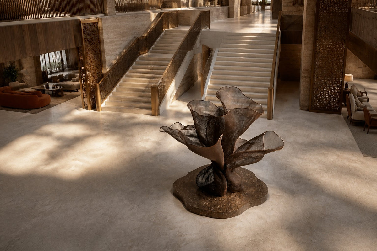 Woven bronze wire sculpture Gienah, a cluster of furled forms opening from a common gathered base.