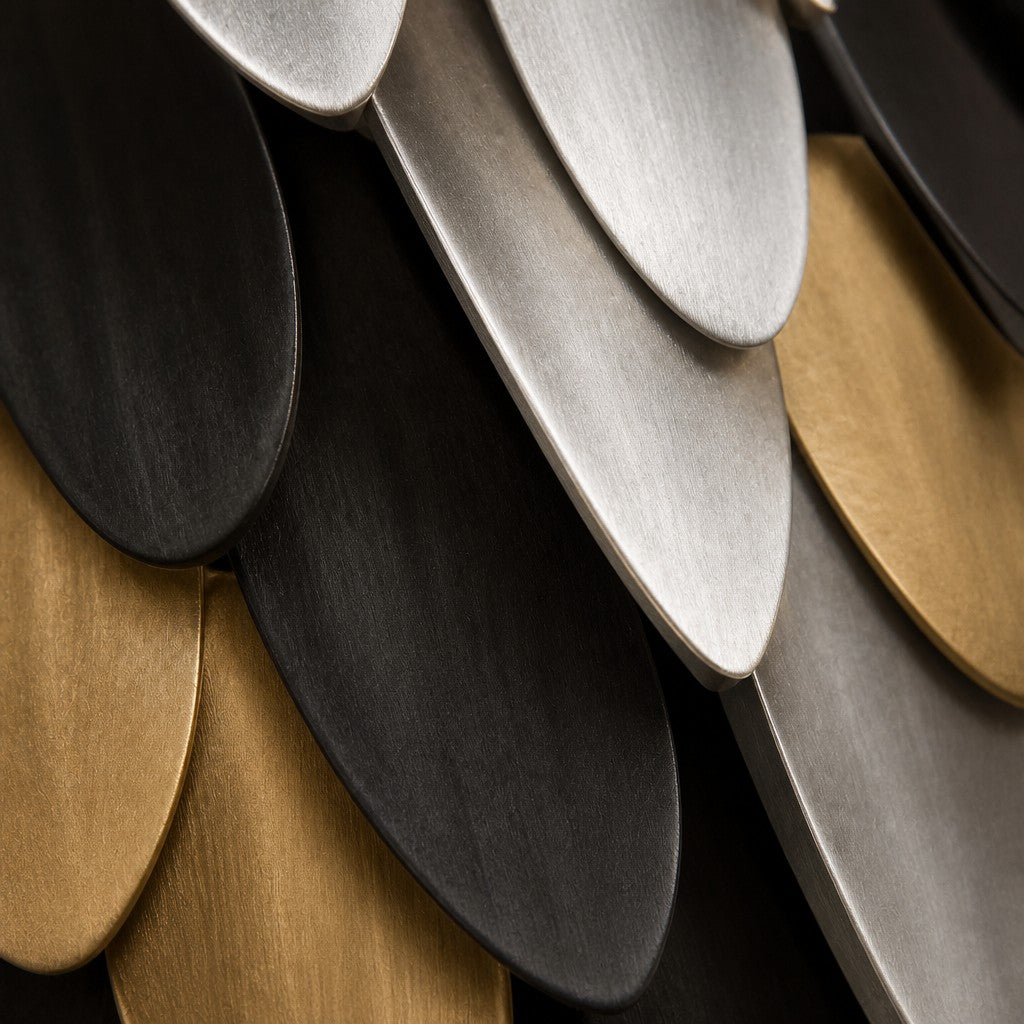 Antique bronze bronze wall sculpture Corona, pointed leaf plates radiating from a turned centre, on a plaster wall.