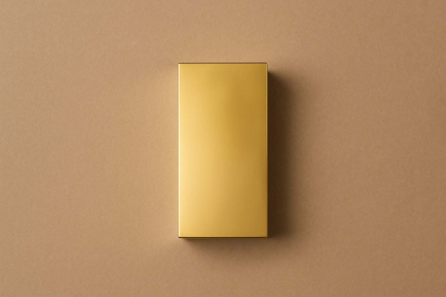 Tall gold PVD pedestal with a closed eye, nose and mouth formed seamlessly out of one face.