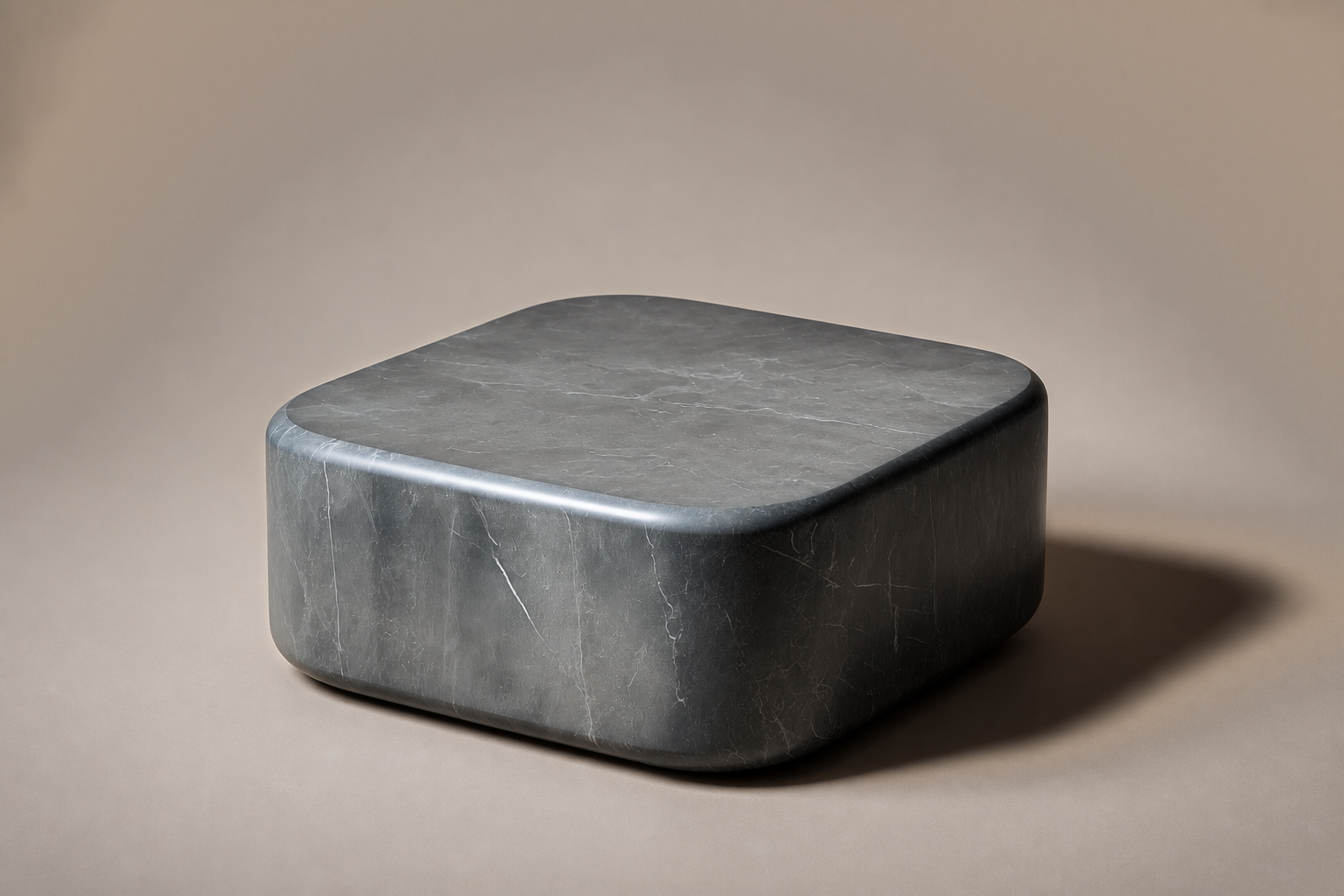 Rounded Cube Base Low black marble plinth base by 1-OPH, three-quarter studio view