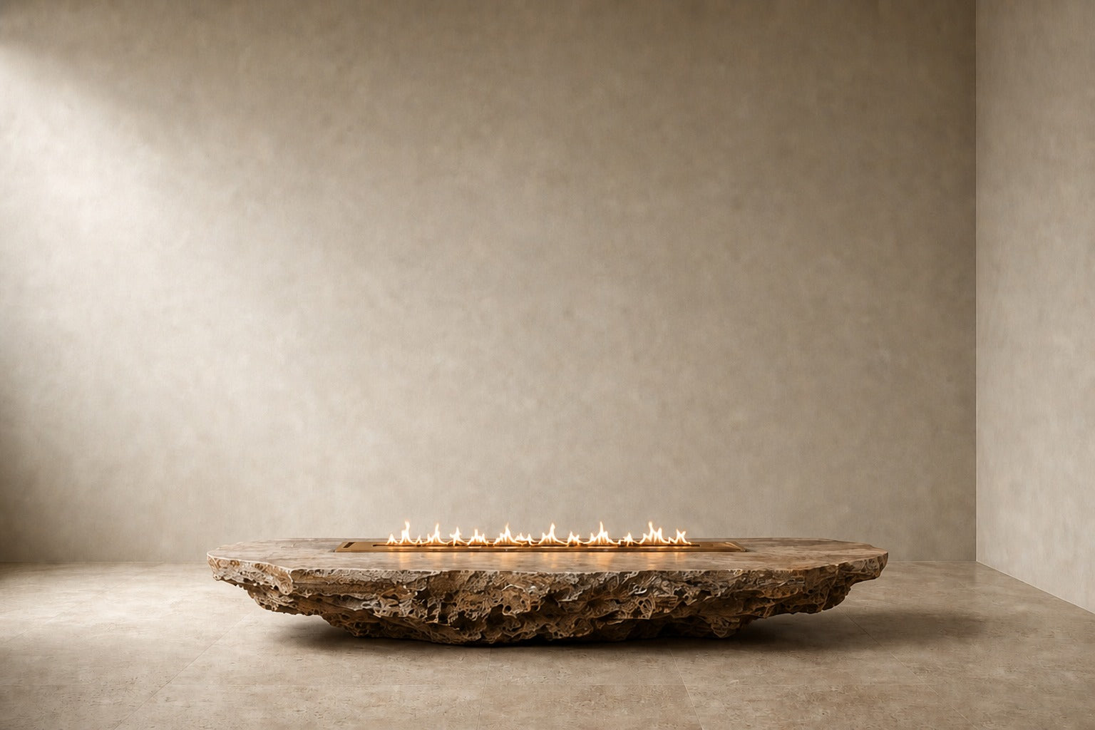 Coral travertine fire table Rimala 220, warm coral and honey, on a pale stone floor.