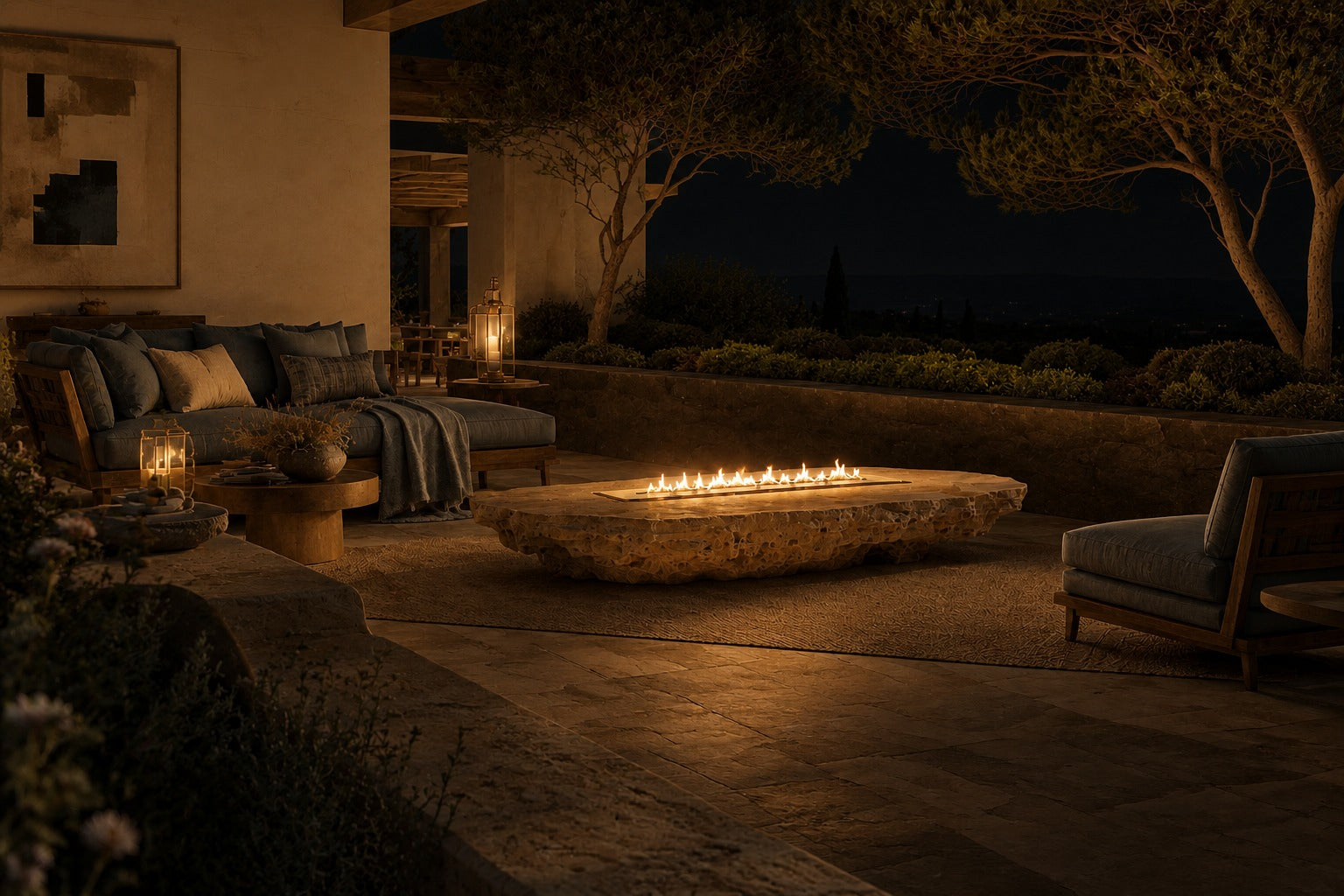 Coral travertine fire table Rimala 220, warm coral and honey, on a pale stone floor.