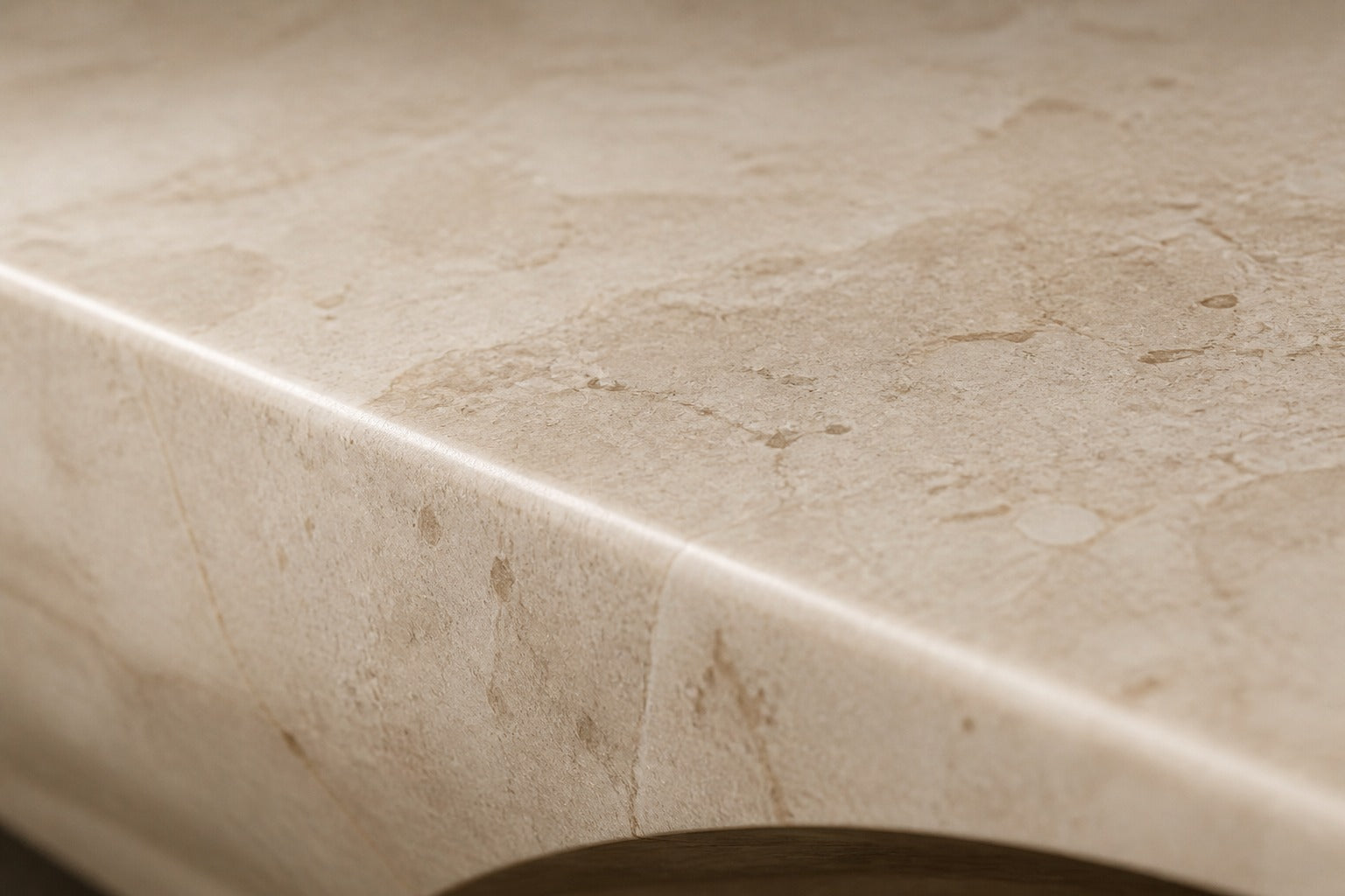 Champagne marble fire table Sahra 220, warm champagne with soft veining, on a pale stone floor.