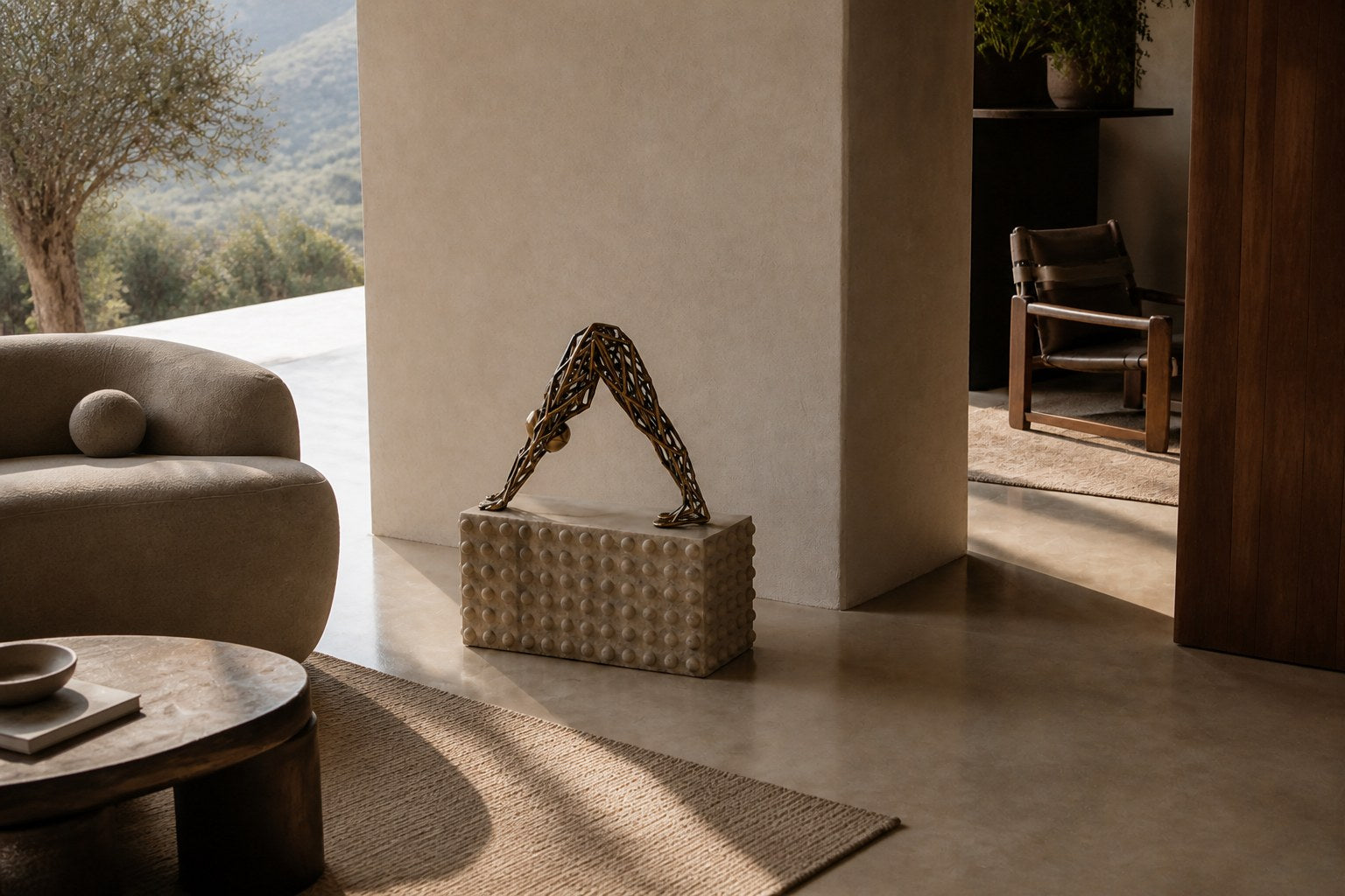 Bronze strut-cage sculpture Sbalzo forming an inverted arch, gilt and blackened, on a beaded travertine block.