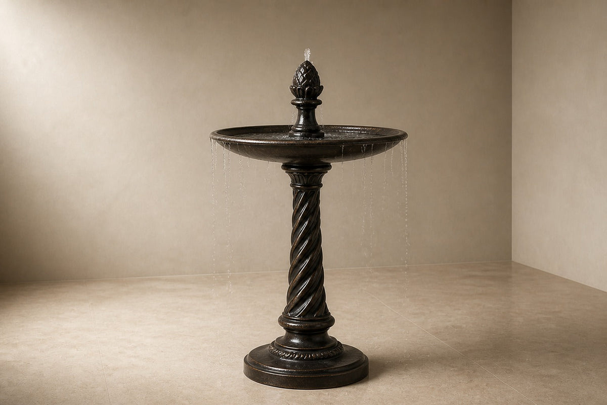 Wayrana Ø65 stone pedestal fountain, three-quarter studio view showing its profile and base