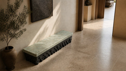 Green marble bench Layan 180, pale green seat, blackened base, on a pale stone floor.