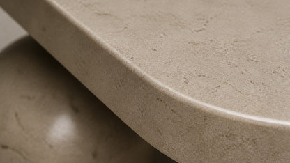 Cream stone bench Quieto 180, warm cream, blackened cone, on a pale stone floor.