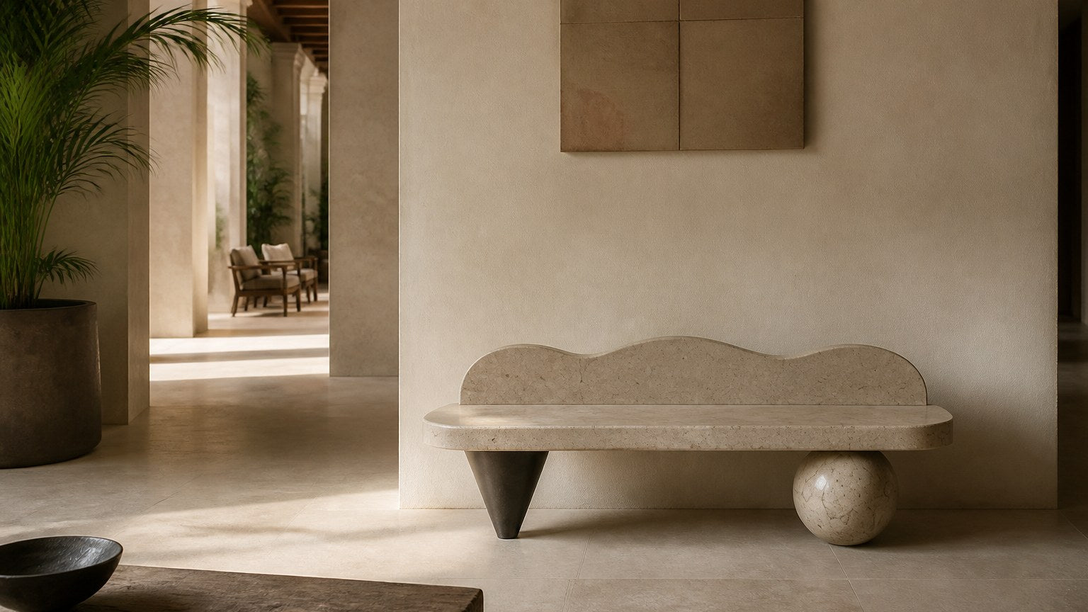 Cream stone bench Quieto 180, warm cream, blackened cone, on a pale stone floor.