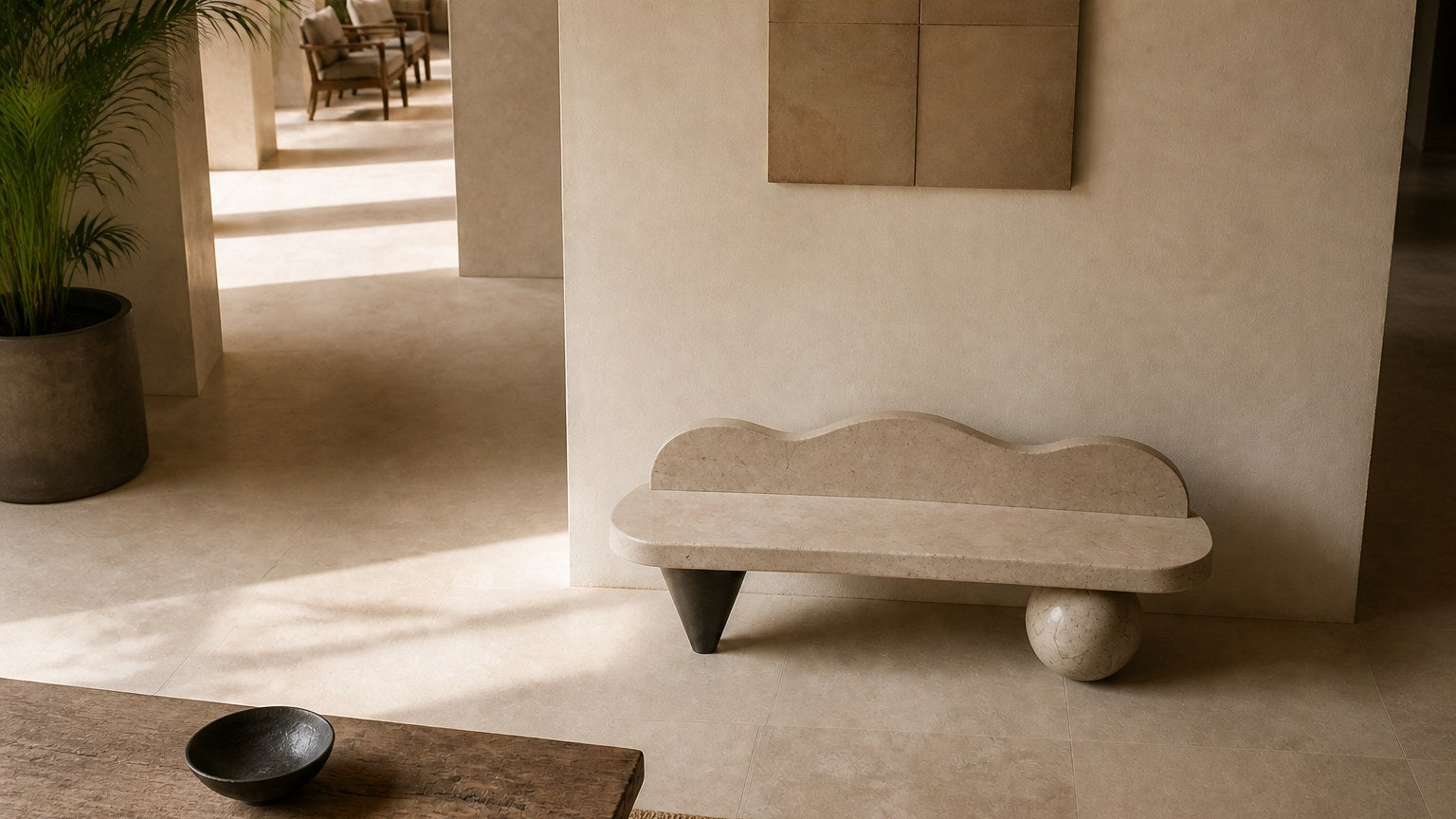 Cream stone bench Quieto 180, warm cream, blackened cone, on a pale stone floor.