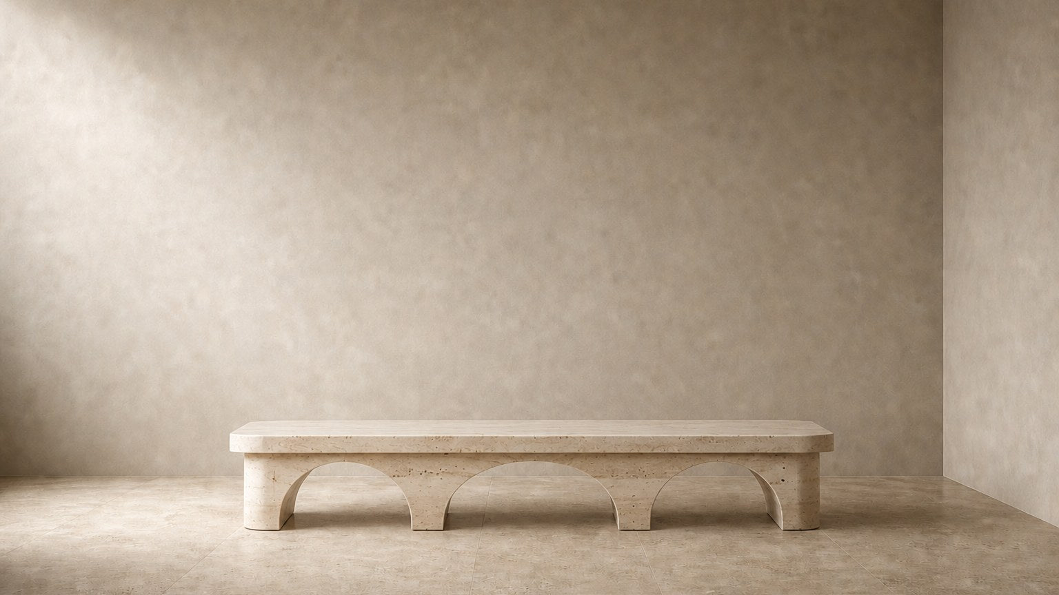 Limestone bench Reposo 180, warm cream, on a pale stone floor.