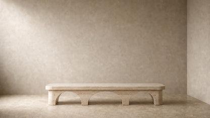 Limestone bench Reposo 180, warm cream, on a pale stone floor.
