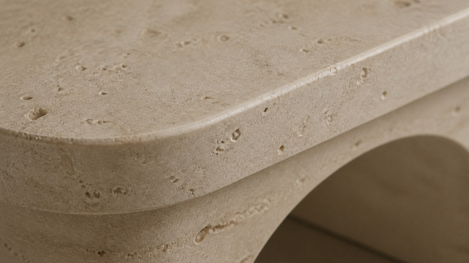 Limestone bench Reposo 180, warm cream, on a pale stone floor.