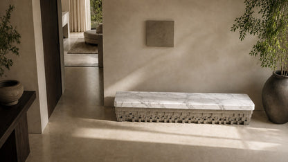 White marble bench Sabat 180, white with grey veining, pale base, on a pale stone floor.