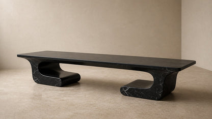 Black stone bench Yutori 180, deep black with white veining, on a pale stone floor.