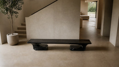 Black stone bench Yutori 180, deep black with white veining, on a pale stone floor.