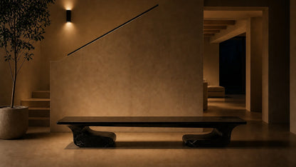 Black stone bench Yutori 180, deep black with white veining, on a pale stone floor.