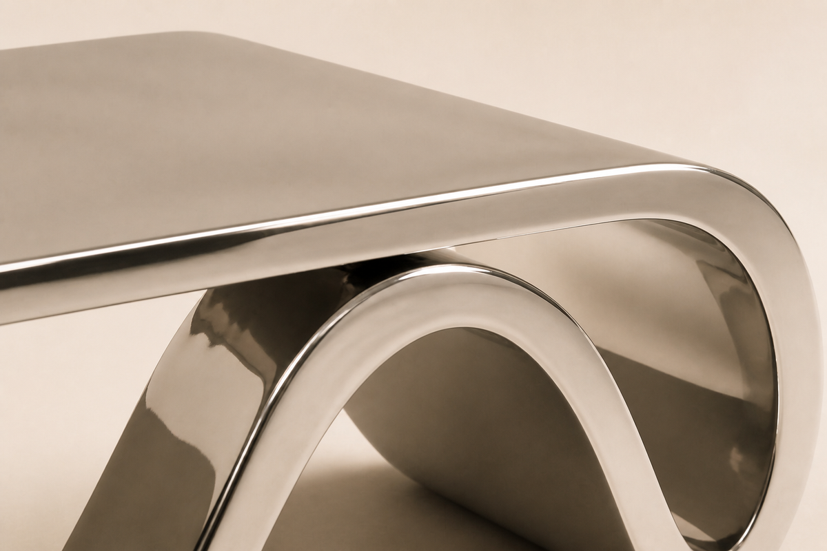 AeroLoop Bench — Ribbon-Form Mirror Stainless Steel Sculpture Bench, close studio detail of the surface and material