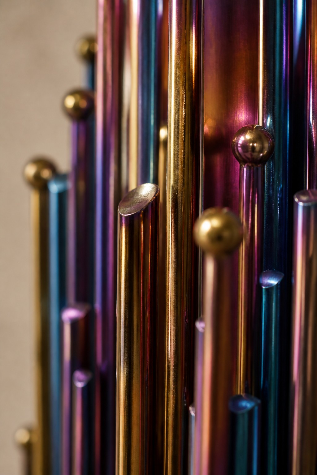 Alwan 150 — 150 cm wall sculpture of iridescent blue stainless steel strands, close studio detail of the surface and material
