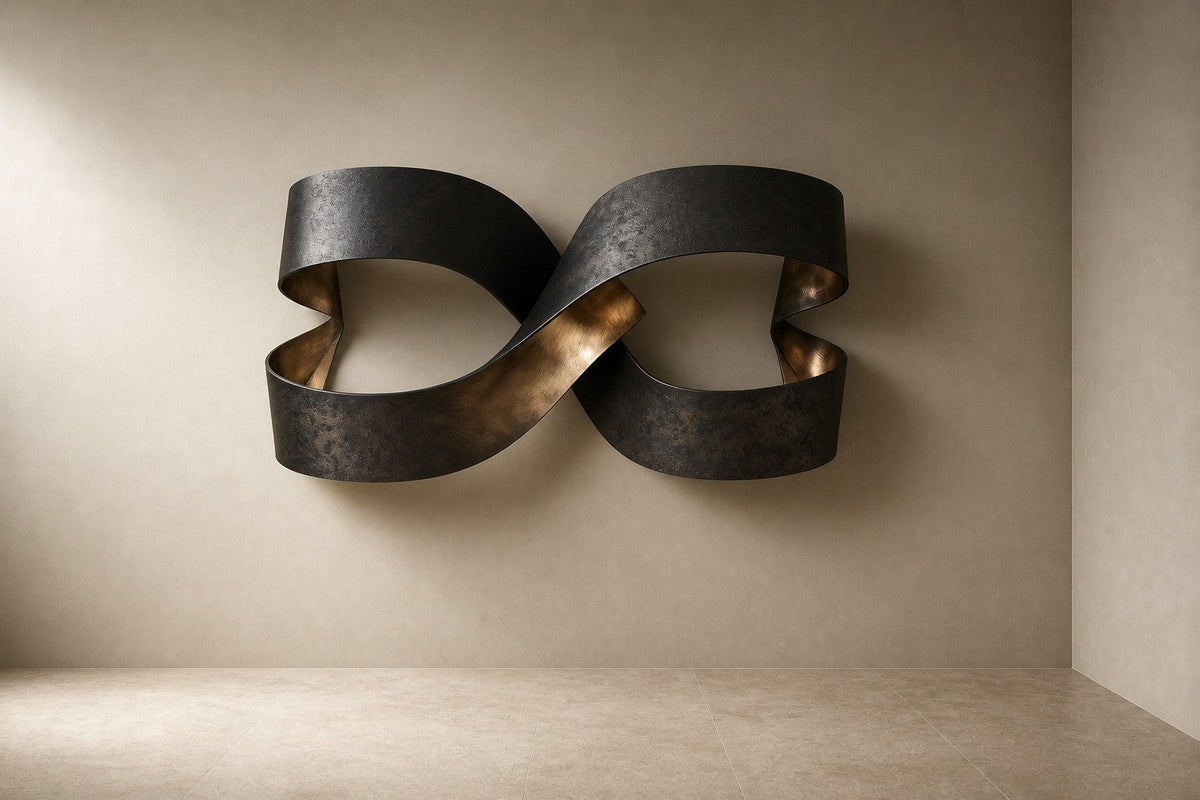 Anello — 140 × 80 cm dark bronze wall sculpture of two linked ribbon loops, three-quarter studio view showing its profile