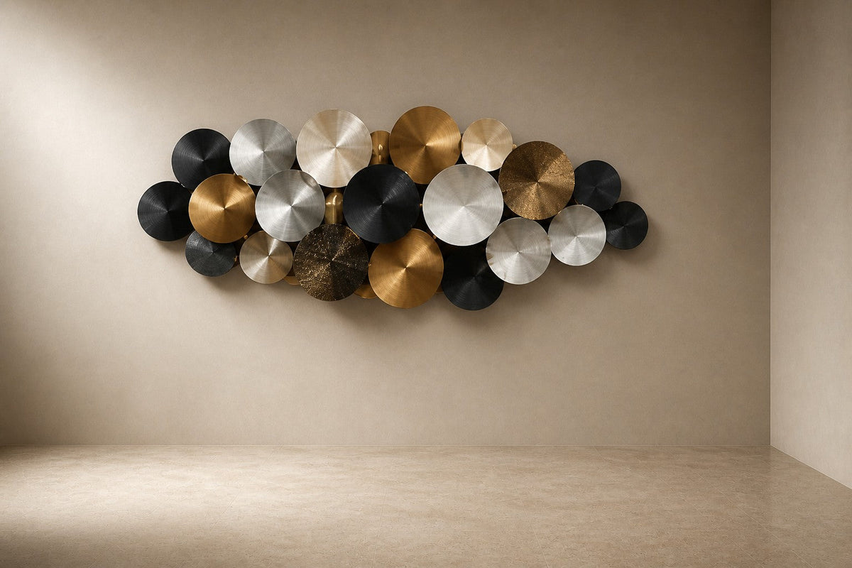 Aqmar — 200 × 80 cm wall cluster of spun discs in black, silver and gold, three-quarter studio view showing its profile