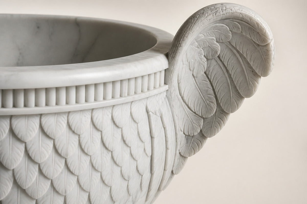 Aquila Wing Marble Urn Planter — 105 cm white Carrara marble urn planter with feather-carved bowl and two carved wing handles, close studio detail of the surface and material