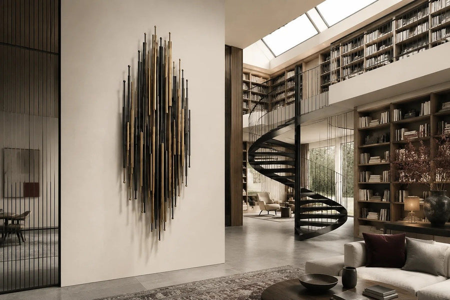 Arboleda — 90 × 160 cm vertical cluster of brass and blackened rods, placed in a furnished room