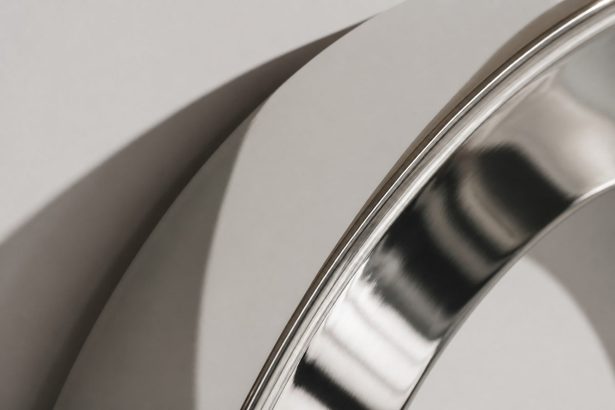 Aro — Ø 160 cm mirror-polished stainless steel ring wall sculpture, close detail of the surface and edge