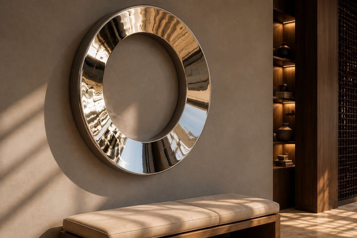 Aro — Ø 160 cm mirror-polished stainless steel ring wall sculpture, close view on the wall