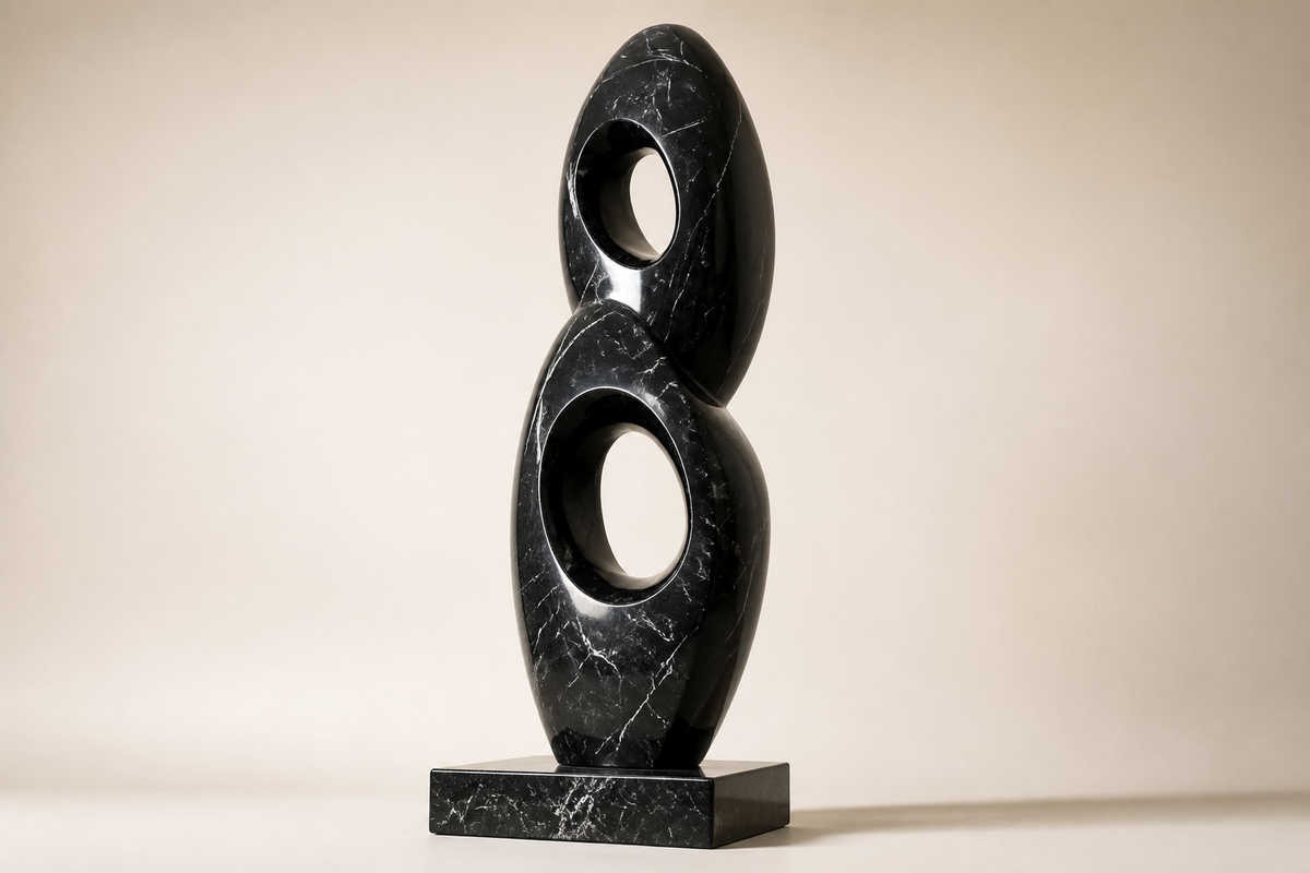 AXIS NOIR marble sculpture, three-quarter studio view showing its profile