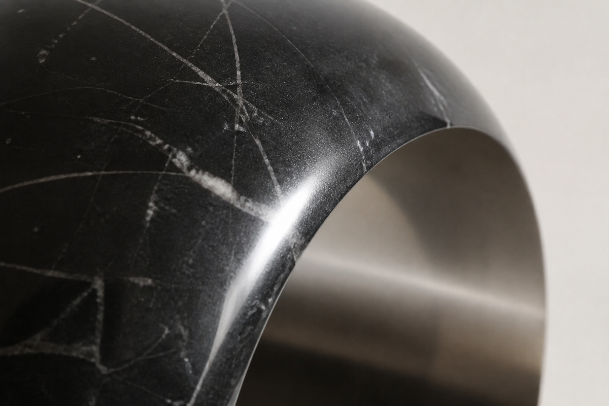 AXIS / VOID I stainless steel sculpture, close studio detail of the surface and material
