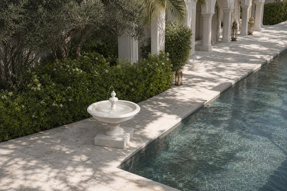 Caserta white marble tiered fountain by 1-OPH, in a Dubai courtyard setting