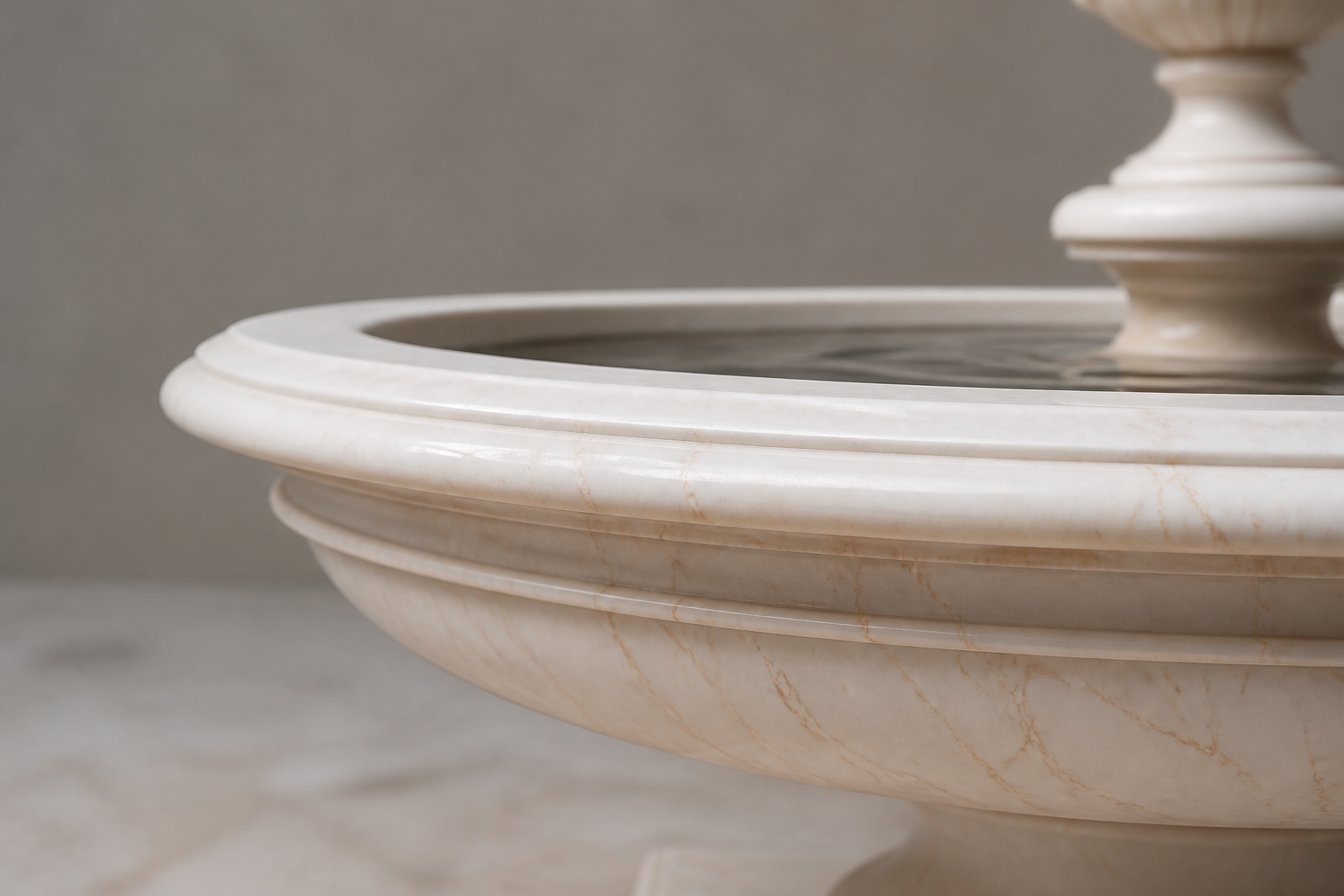 Nemi cream stone tiered fountain by 1-OPH, in a Dubai courtyard setting