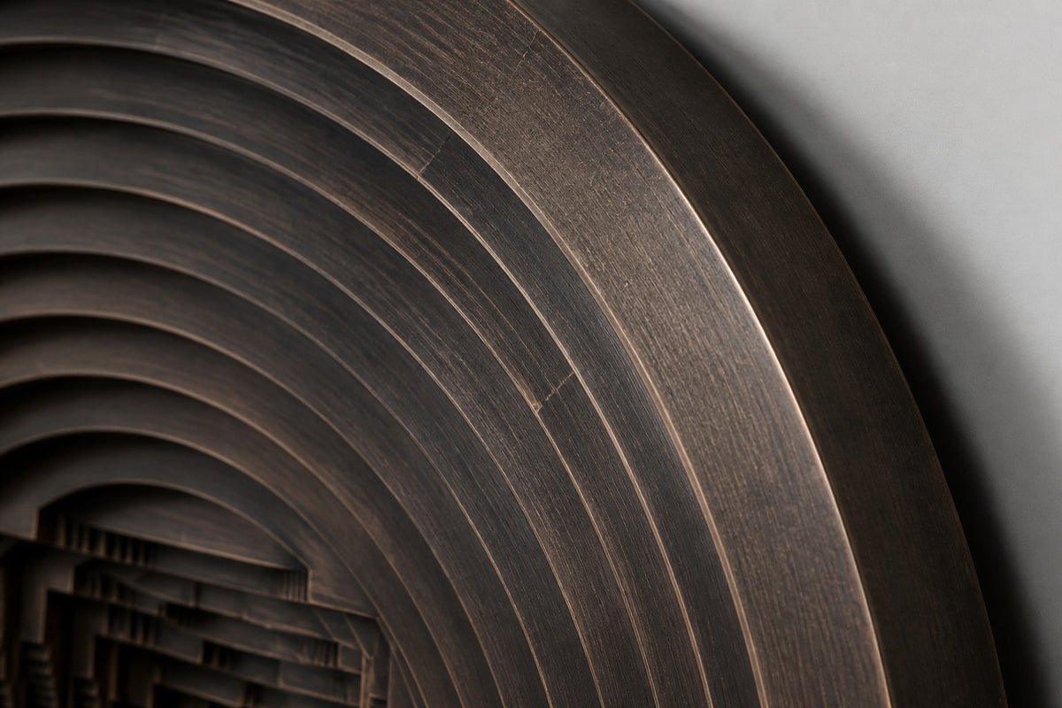 Baori — Ø 200 cm dark patinated bronze circular wall relief of a stepwell, close detail of the surface and edge