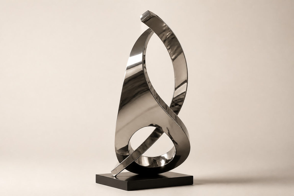 Barq — 200 cm mirror-polished steel twisting ribbon sculpture on a black base, three-quarter studio view showing its profile