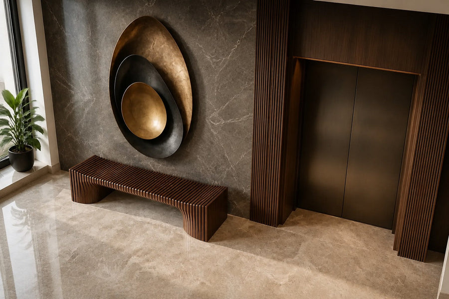 Bayda 120 — 120 cm gold and dark bronze oval wall sculpture of nested bowls, seen from above in the room