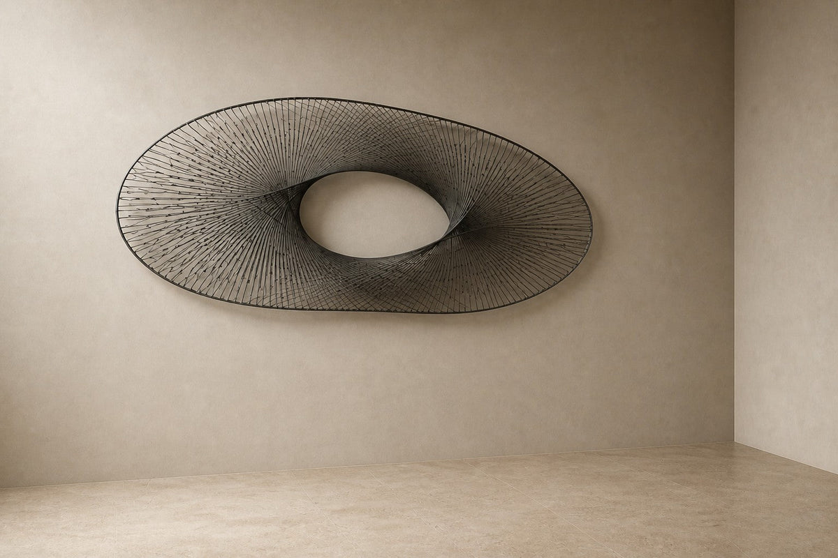 Baydawi — 180 × 90 cm brushed steel wire wall sculpture woven into an open oval, three-quarter studio view showing its profile