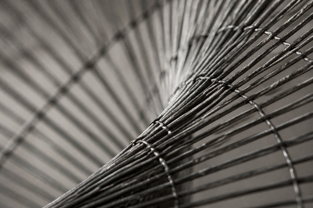 Baydawi — 180 × 90 cm brushed steel wire wall sculpture woven into an open oval, close studio detail of the surface and material