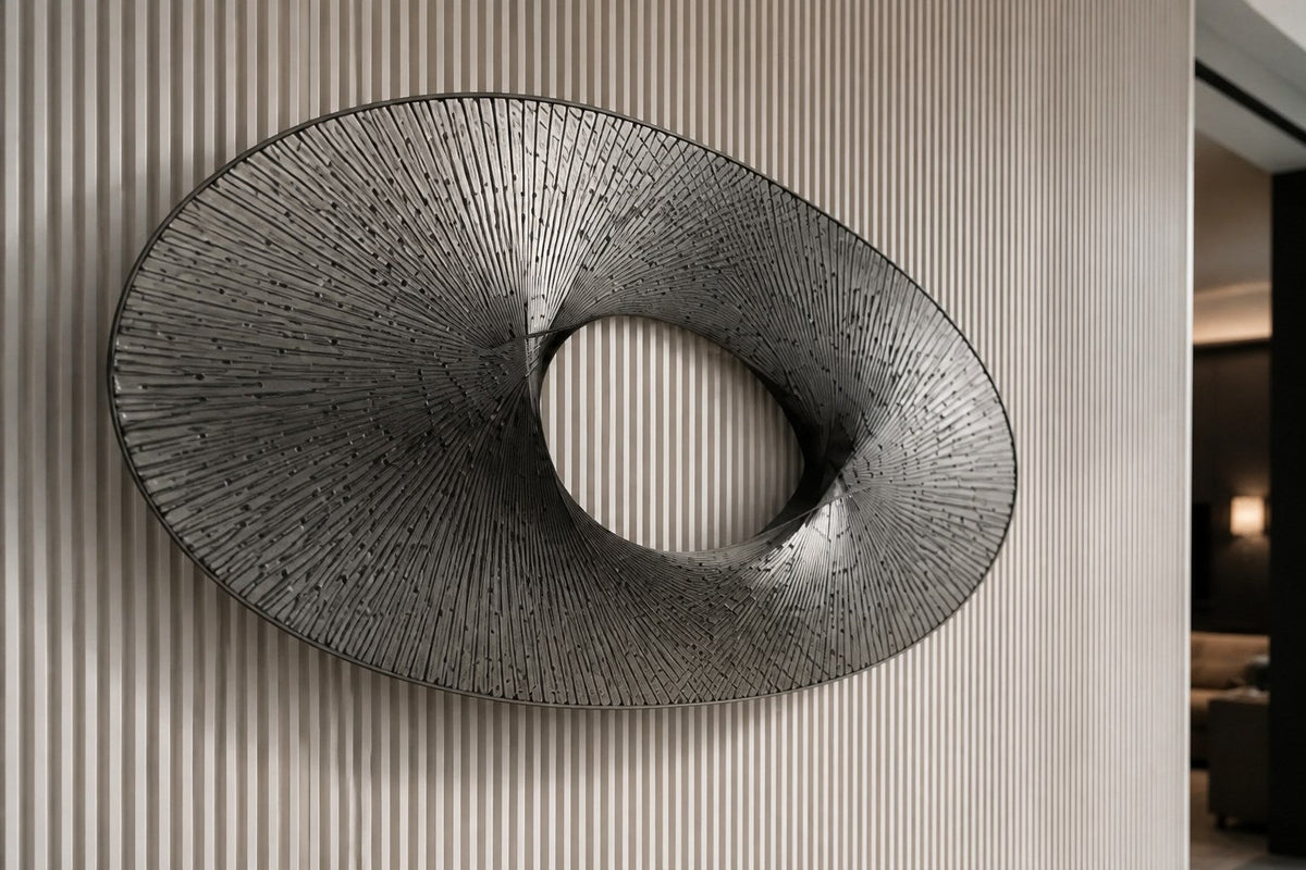 Baydawi — 180 × 90 cm brushed steel wire wall sculpture woven into an open oval, close view in the room