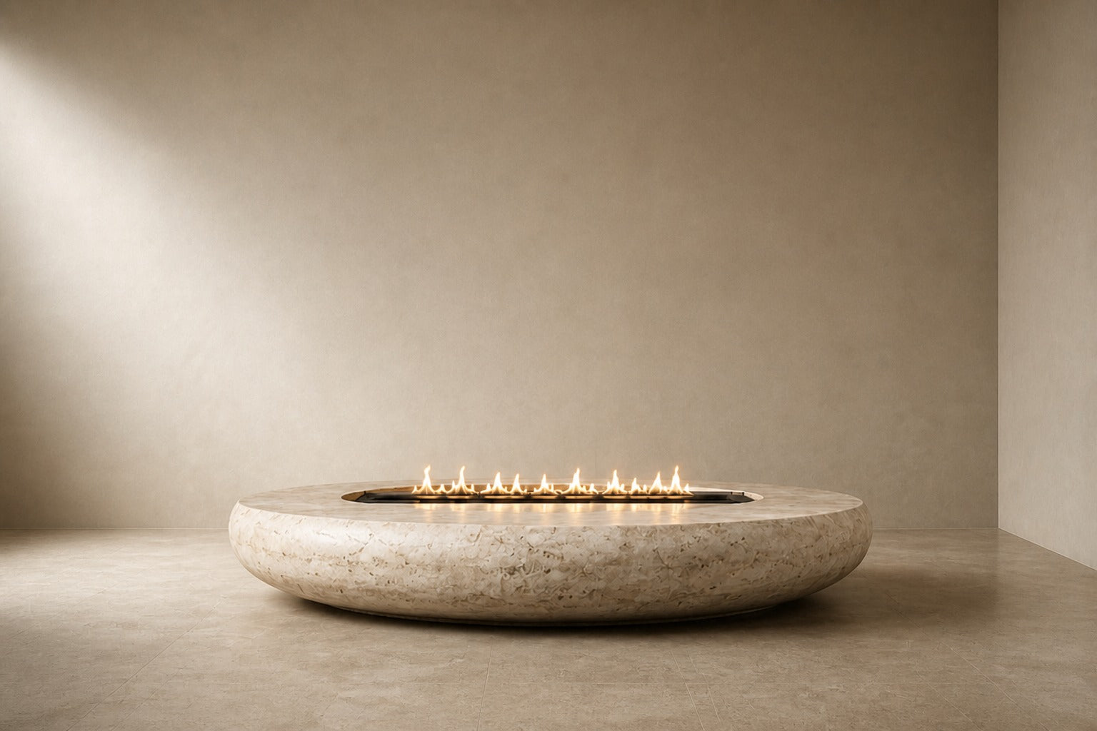 Pale fossil travertine fire bowl Bruna Ø180, pale cream with dense fossil shell, on a pale stone floor.