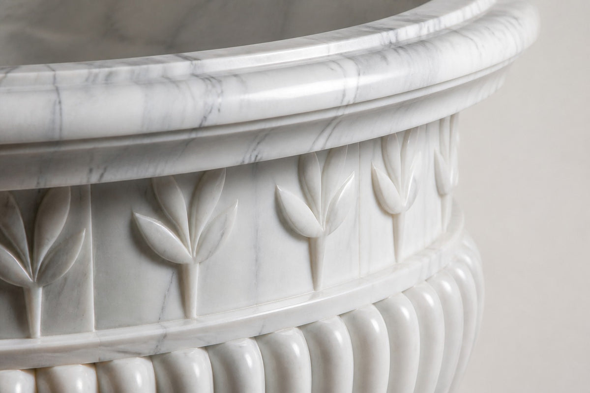 Calacatta Laurel Marble Urn Planter — 80 cm white Calacatta marble urn planter with a laurel-leaf frieze and fluted body, close studio detail of the surface and material