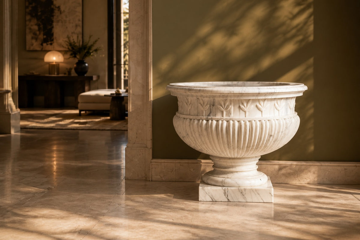 Calacatta Laurel Marble Urn Planter — 80 cm white Calacatta marble urn planter with a laurel-leaf frieze and fluted body, close view in the room