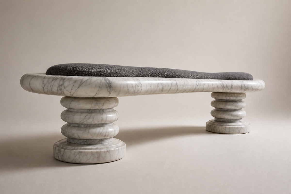 Calma stone sculptural bench, three-quarter studio view showing its profile