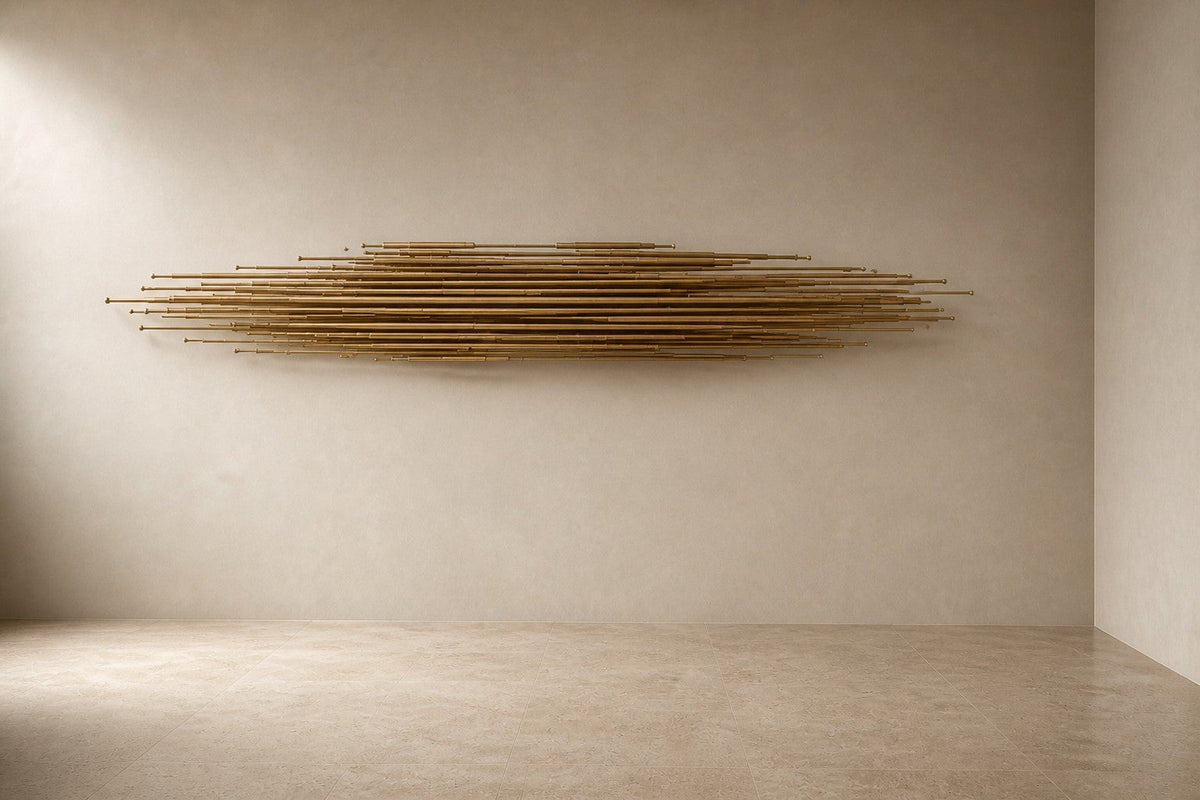 Canaveral — 220 × 40 cm long horizontal sheaf of polished brass rods, three-quarter studio view showing its profile