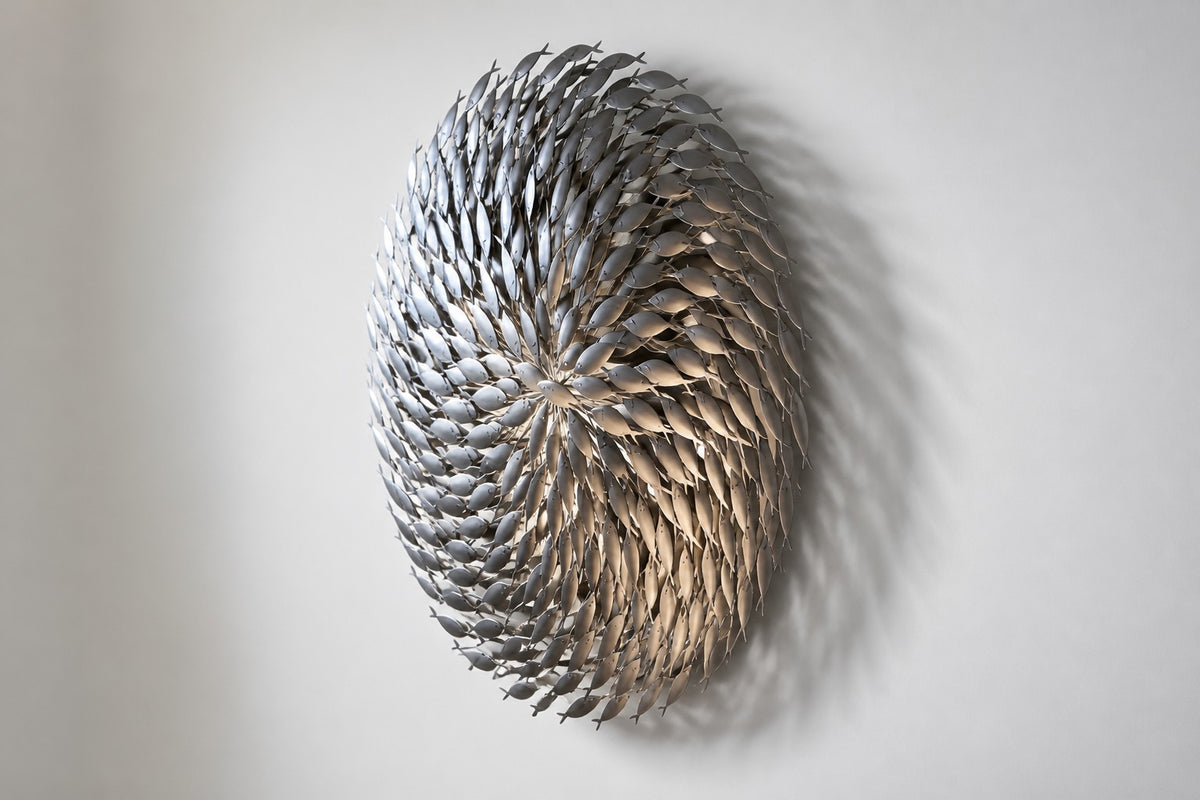 Cardume — Ø 200 cm satin stainless steel shoal of fish wall sculpture, studio side angle showing its depth