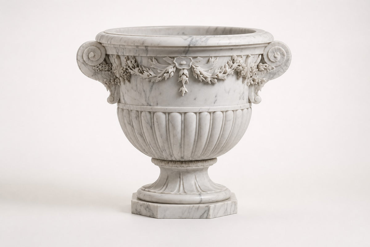 Carrara Floral Garland Marble Urn Planter — 95 cm white Carrara marble urn planter with a carved floral garland and two scroll handles, studio view of the whole piece