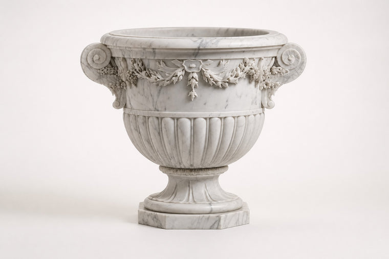 Carrara Floral Garland Marble Urn Planter — 95 cm white Carrara marble urn planter with a carved floral garland and two scroll handles, studio view of the whole piece